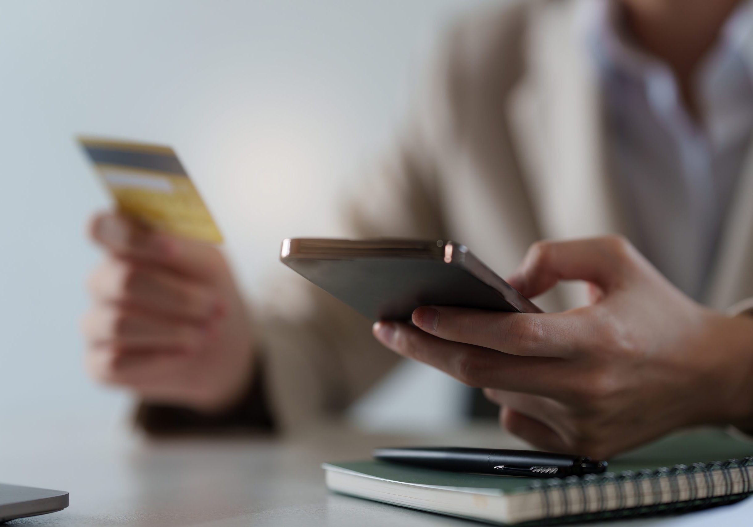 Young woman making online banking to payment with credit card and smartphone. Online Shopping concept